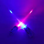 Two LED lightsabers, made with straws and paper, glowing in blue and pink.